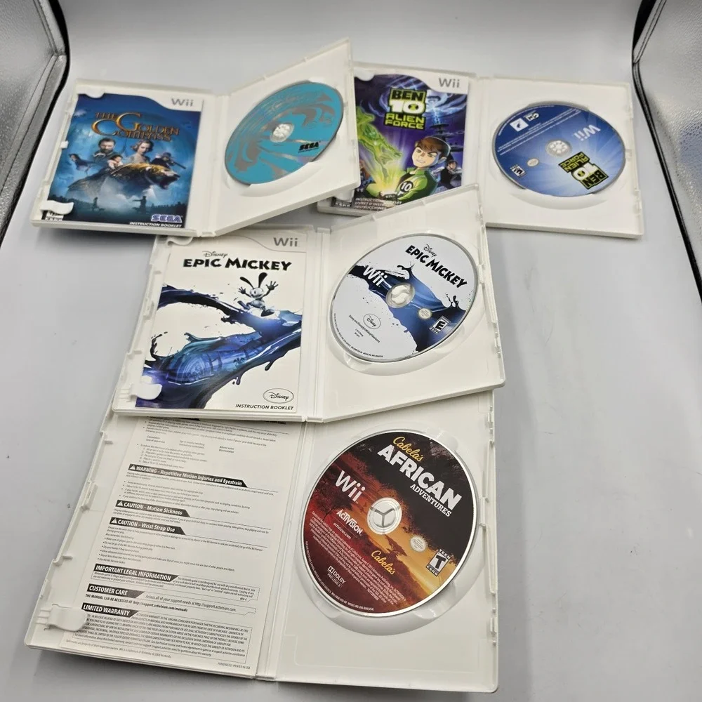 Nintendo Wii Mixed 4 Game Lot Golden Compass Ben10 Epic Mickey African Adventure
